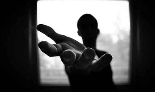 Silhouette reaching out for help