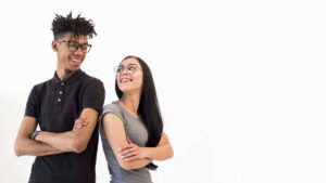 young man and woman shoulder to shoulder wearing glasses