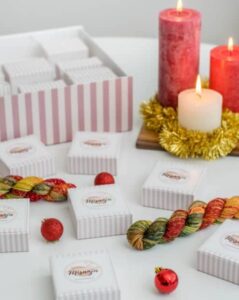 hand dyed yarn, lit candles, boxes from Misanja's yarn advent calendar