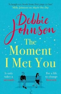 Book cover for The Moment I Met You by Debbie Johnson. Stylised woman and man sat a distance apart on a bench with a blue background and stars covering the front cover