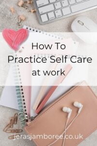 flat lay desk with notebooks, keyboard, stationery