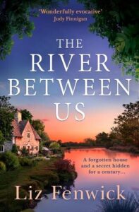 Book cover for The River Between Us by Liz Fenwick. The river at sunset with a cottage standing on one of the banks looking over the river