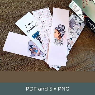 Bookaholic bookmarks printed and laminated in a fan shape on a wooden table