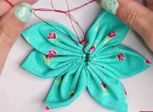 partially made fabric flower from scrap green fabric