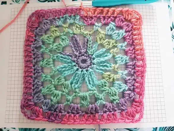daisy in a square granny square crocheted in multiple colours