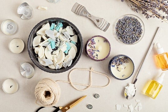 half used tealights, wicks, broken up candles in a bowl for melting and making new candles