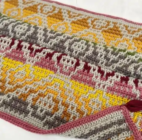 multi-coloured mosaic crochet blanket