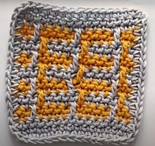 Mosaic crochet coaster in gold and grey colours
