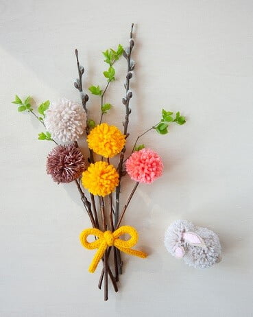 bouquet of flowers made from scrap yarn pom poms