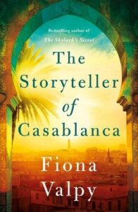 Book cover for The Storyteller of Casablanca. View from an archway over the tops of buildings in Morocco