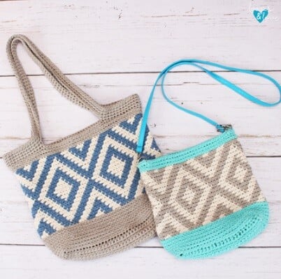 two different sized tapestry crochet tote bags - one in blue, white and beige, one in beige, white and turqoise