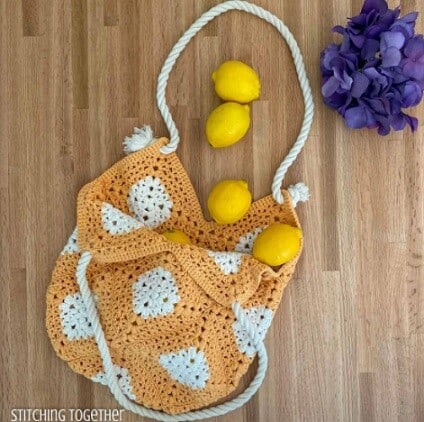 Market bag crocheted in white and orange granny squares