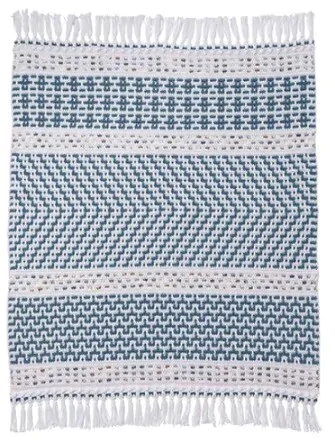 A mosaic crochet blanket with 7 sections and tassels is laid out flat
