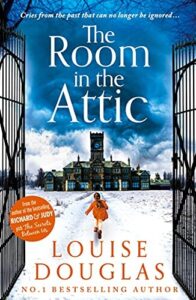 Book cover for The Room in the Attic by Louise Douglas. Large black gates open to a snowy ground with buildings in the distance. A girl with dark hair and red coat is walking towards the buildings