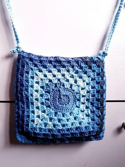 granny square bag in self striping yarn in shades of blue