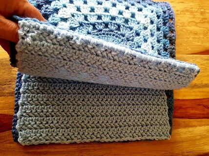 the inner lining of the granny square bag pattern is sewn to the top of both granny squares