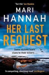 book cover for Her Last Request by Mari Hannah. The readers looks onto the edge of land with homes set a little back and the sea is crashing into the land