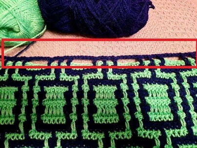 one row of missed stitches in blue as part of the mosaic crochet technique