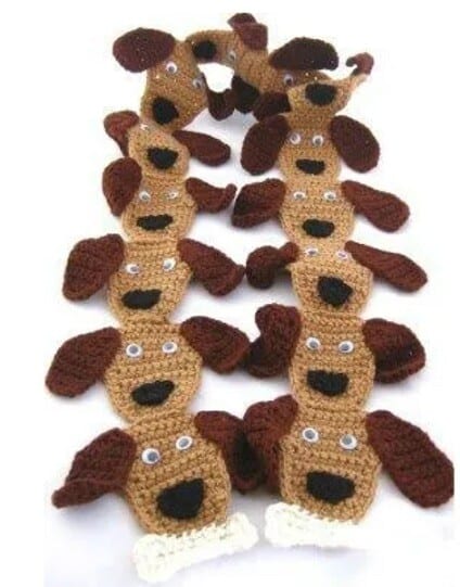 puppy dog crochet motifs are joined together to make a unique scarf