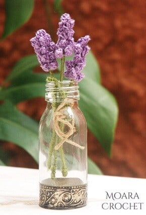 crocheted lavender in a glass bottle