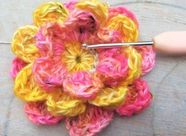 crochet peony in pink and yellow