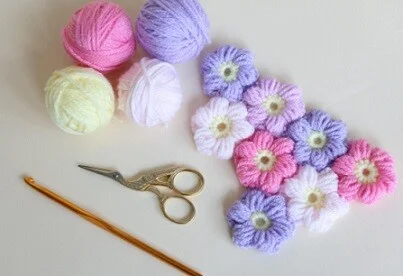 crochet puff flowers in pastel purple, pink and white