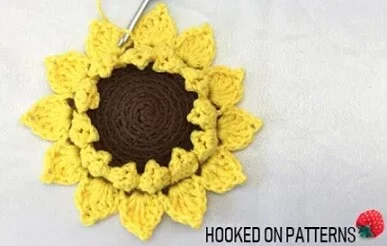 crochet sunflower worked as a coaster