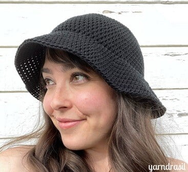 woman wearing black crochet bucket hat