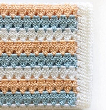 granny stitch blanket in peach, light blue and white