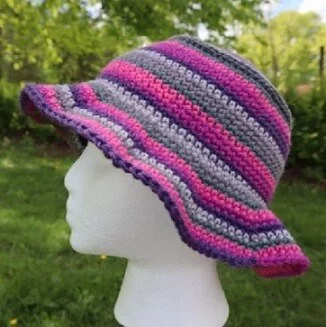 bucket hat with a floppy brim crocheted in self striping yarn