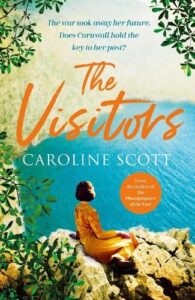 book cover for The Visitors by Caroline Scott. A woman in an orange coat and black head scarf sits on rocks overlooking the sea