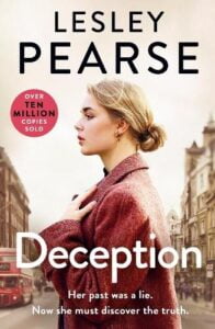 book cover for Deception by Lesley Pearse. A woman in a winter coat is standing sideways on a high street