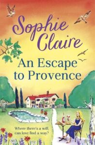Book cover for An Escape to Provence by Sophie Claire. A woman with long blond hair in a blue summer dress is sitting at a table drinking red wine with a villa in the distance
