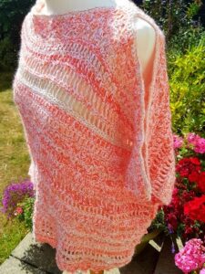 Open shouldered crochet poncho styled on a mannequin