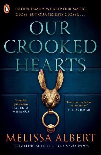 Book cover for Our Crooked Hearts by Melissa Albert.  A dark blue door has a gold door knocker in the shape of a rabbit