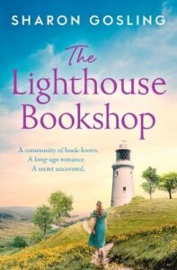 book cover for The Lighthouse Bookshop by Sharon Gosling. A woman is walking up a hill towards a lighthouse