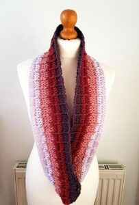 ombre crochet infinity scarf styled on a mannequin