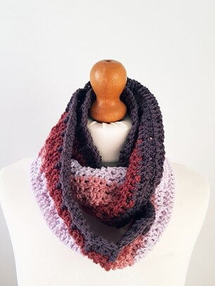 crocheted infinity scarf worn looped around the neck