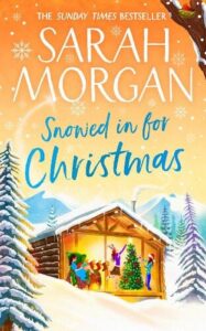 book cover for Snowed in for Christmas by Sarah Morgan. A vector showing a snowy scene and a lodge with two people decorating a Christmas tree