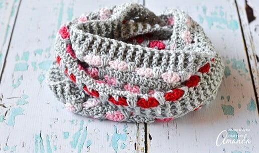 Infinity scarf crocheted in grey with red and pink hearts