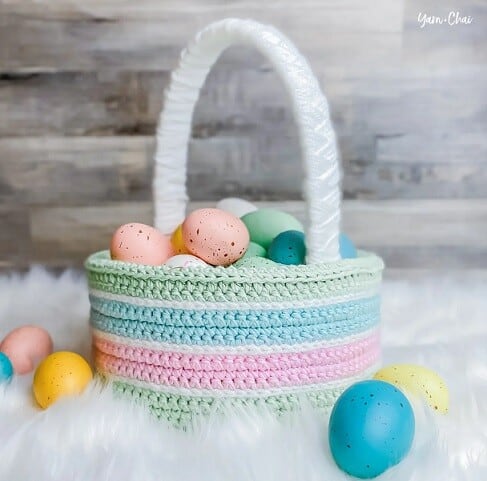 Basket crocheted in pastel colours filled with pastel coloured eggs
