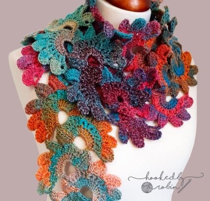 brightly coloured motif scarf styled on a mannequin