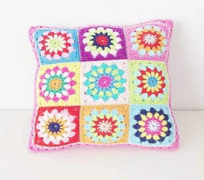 Pillow crocheted in bright granny squares