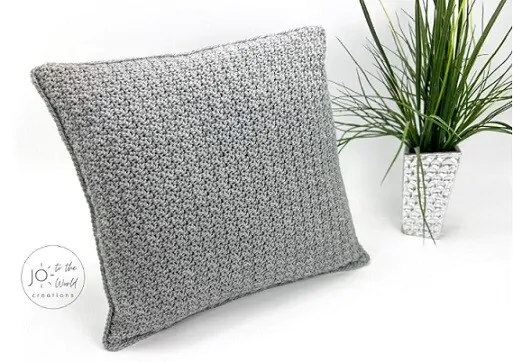textured crochet pillow in grey