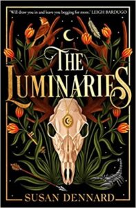 book cover for The Luminaries by Susan Dennard. An unusual skull is surrounded by unusual flora, an arrow and a scorpion