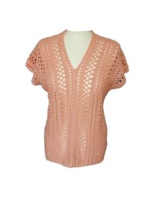 Front view of a crochet summer top styled on a mannequin