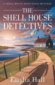 book cover for The Shell House Detectives by Emylia Hall. A coastal path curves to the left with a blue bungalow in the near distance. A shadow of a man is on the path