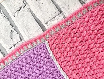 blanket stitch on a border of a crochet blanket
