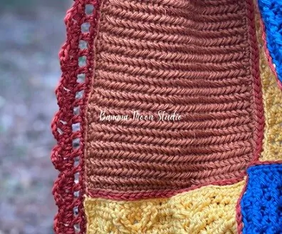 close up of a shell stitch border