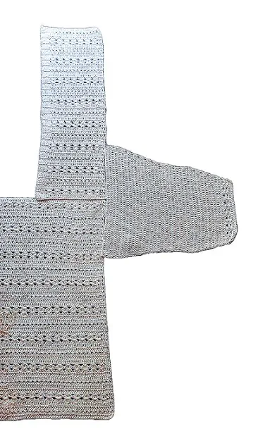 Front, back and sleeve of a cardigan set out to show where to sew the sleeve